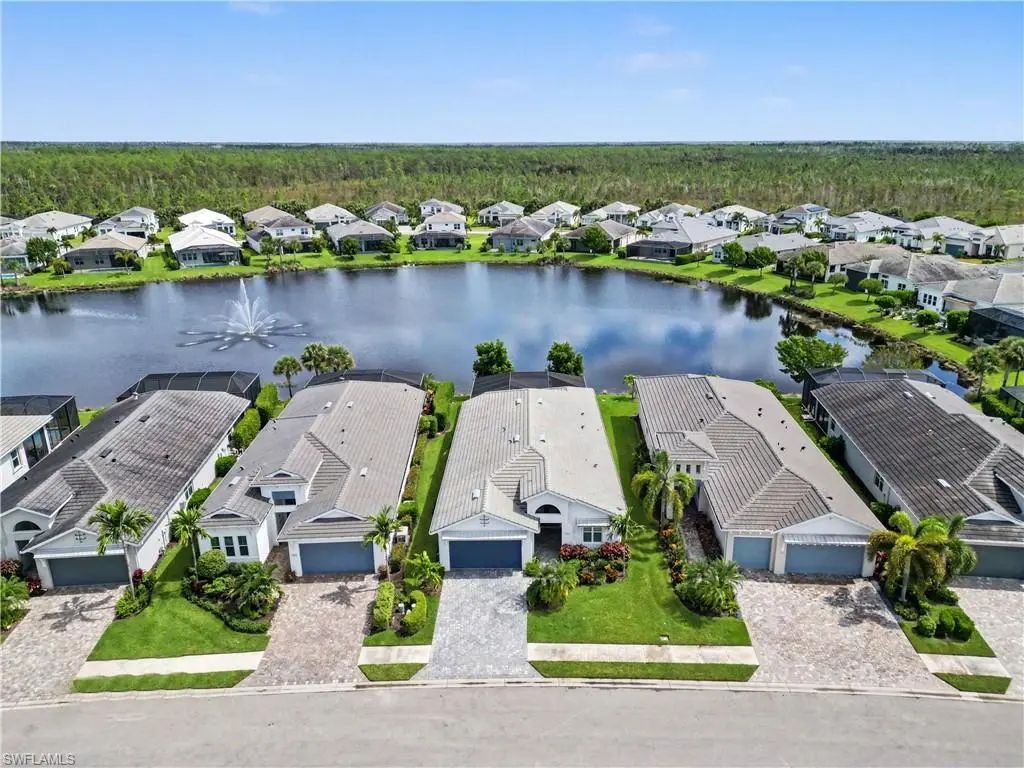 Aerial view of the lake and homes along Montserrat Drive in Azure at Hacienda Lakes, Naples, Florida